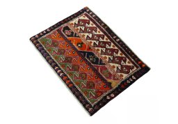 Corner detail of 2000s Shiraz rug showing border pattern and Wool pile