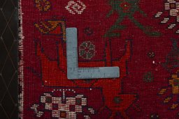 Backside of handmade 2000s Shiraz rug showing knot structure and weave density