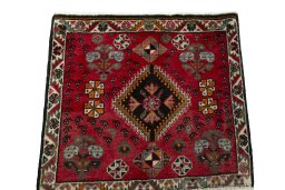 Surface texture of 2000s Shiraz rug with natural Wool and intricate pattern