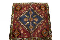 Surface texture of 2000s Shiraz rug with natural Wool and intricate pattern