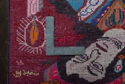 Backside of handmade 2000s Shiraz rug showing knot structure and weave density