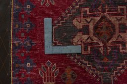 Backside of handmade 2000s Shiraz rug showing knot structure and weave density