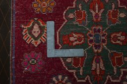 Backside of handmade 2000s Shiraz rug showing knot structure and weave density
