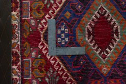 Backside of handmade 2000s Shiraz rug showing knot structure and weave density