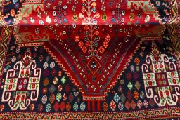 Corner detail of 2000s Shiraz rug showing border pattern and Wool pile