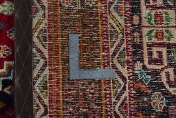 Surface texture of 2000s Shiraz rug with natural Wool and intricate pattern