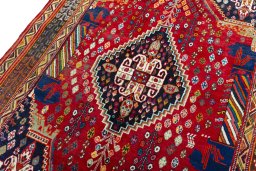 Backside of handmade 2000s Shiraz rug showing knot structure and weave density