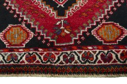 Central medallion detail of 2000s Shiraz rug from Iran / Persia