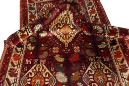 Corner detail of 2000s Shiraz rug showing border pattern and Wool pile