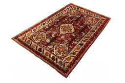 Corner detail of 2000s Shiraz rug showing border pattern and Wool pile