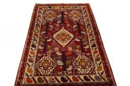 Surface texture of 2000s Shiraz rug with natural Wool and intricate pattern