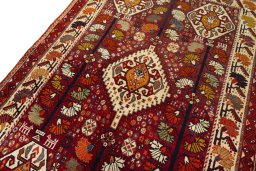 Backside of handmade 2000s Shiraz rug showing knot structure and weave density