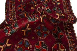 Corner detail of 2000s Shiraz rug showing border pattern and Wool pile
