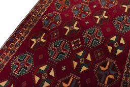 Backside of handmade 2000s Shiraz rug showing knot structure and weave density