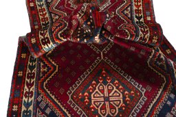Corner detail of 2000s Shiraz rug showing border pattern and Wool pile