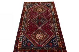 Surface texture of 2000s Shiraz rug with natural Wool and intricate pattern