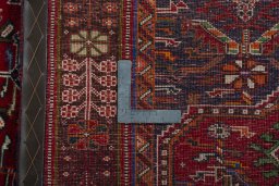 Surface texture of 2000s Shiraz rug with natural Wool and intricate pattern