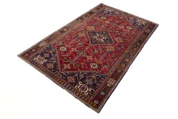 Corner detail of 2000s Shiraz rug showing border pattern and Wool pile