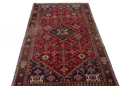 Surface texture of 2000s Shiraz rug with natural Wool and intricate pattern