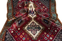 Corner detail of 2000s Shiraz rug showing border pattern and Wool pile