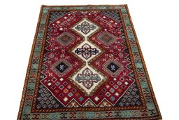 Surface texture of 2000s Shiraz rug with natural Wool and intricate pattern