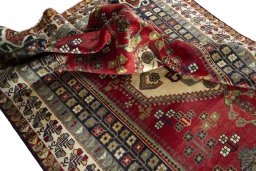 Corner detail of 2000s Shiraz rug showing border pattern and Wool pile