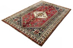 Corner detail of 2000s Shiraz rug showing border pattern and Wool pile