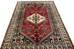 Surface texture of 2000s Shiraz rug with natural Wool and intricate pattern