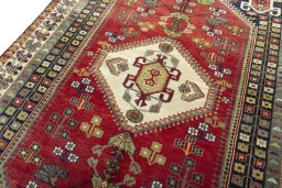 Backside of handmade 2000s Shiraz rug showing knot structure and weave density