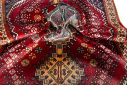 Corner detail of 2000s Shiraz rug showing border pattern and Wool pile