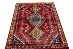 Surface texture of 2000s Shiraz rug with natural Wool and intricate pattern
