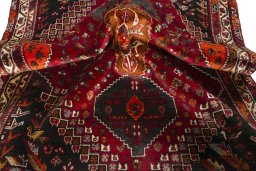 Corner detail of 2000s Shiraz rug showing border pattern and Wool pile