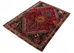 Corner detail of 2000s Shiraz rug showing border pattern and Wool pile