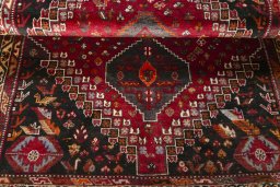 Full view of 2000s Shiraz rug from Iran / Persia, 165 × 120 cm in Red tones