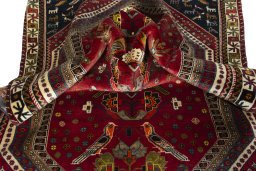 Corner detail of 2000s Shiraz rug showing border pattern and Wool pile