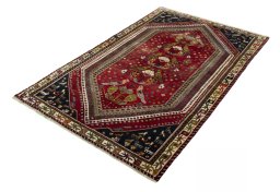 Corner detail of 2000s Shiraz rug showing border pattern and Wool pile