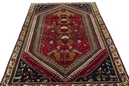 Surface texture of 2000s Shiraz rug with natural Wool and intricate pattern