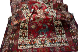 Corner detail of 2000s Shiraz rug showing border pattern and Wool pile
