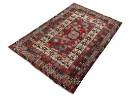 Corner detail of 2000s Shiraz rug showing border pattern and Wool pile