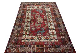 Surface texture of 2000s Shiraz rug with natural Wool and intricate pattern