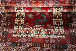 Full view of 2000s Shiraz rug from Iran / Persia, 200 × 128 cm in Red tones