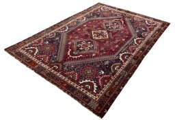 Corner detail of 2000s Shiraz rug showing border pattern and Wool pile
