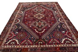 Surface texture of 2000s Shiraz rug with natural Wool and intricate pattern