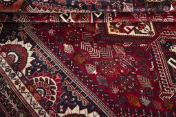 Full view of 2000s Shiraz rug from Iran / Persia, 320 × 222 cm in Red tones