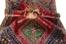 Corner detail of 2000s Shiraz rug showing border pattern and Wool pile