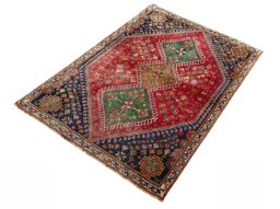 Corner detail of 2000s Shiraz rug showing border pattern and Wool pile