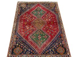 Surface texture of 2000s Shiraz rug with natural Wool and intricate pattern