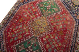 Backside of handmade 2000s Shiraz rug showing knot structure and weave density