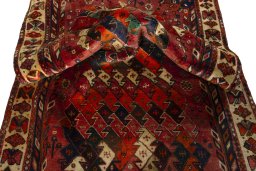 Corner detail of 2000s Shiraz rug showing border pattern and Wool pile