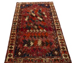Surface texture of 2000s Shiraz rug with natural Wool and intricate pattern